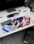 Anime girl desk pad 36x16 inches showing black-haired armored heroine clashing with red-haired rival in motion.