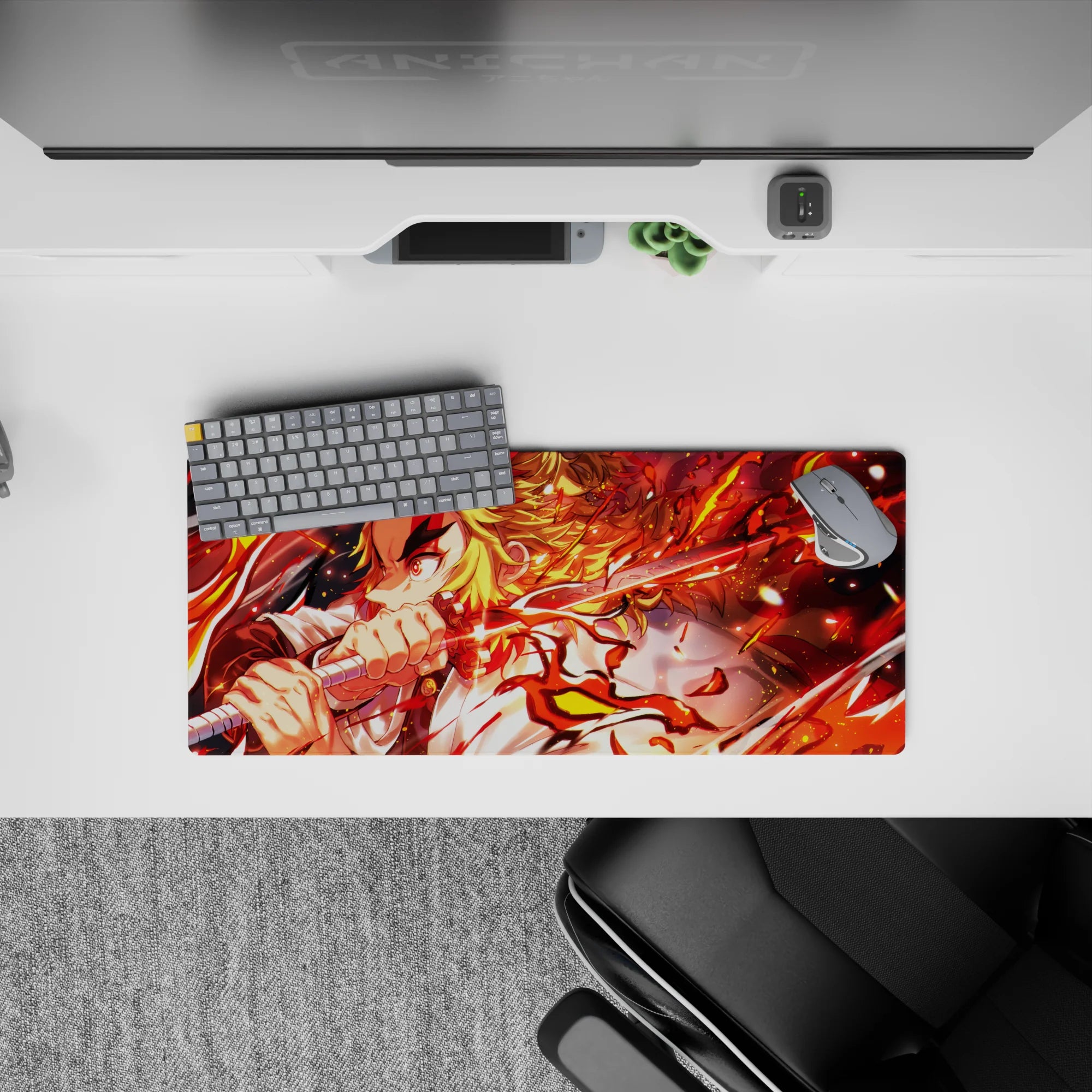 Rengoku blazing on a 28x12 inch anime mouse pad, flames from katana in reds and golds, vibrant Demon Slayer design.