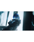 40x20 inches anime girl desk pad with blue-haired girl, dark jacket, sleek bangs, rainy city window glow.