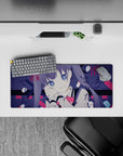 28x12 inches anime desk mouse pad in moody navy and crimson with pill icons and handwritten Japanese text.