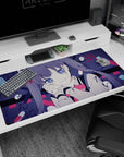 Close-up anime girl gazing up, cheek on hand, glassy eyes and twin tails on a 40x20 inches desk pad.