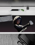 High-contrast gray shadows, black armor, and crimson face streaks on anime girl desk pad 36x16 inches.