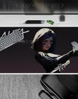 Black and gray anime desk pad 40x20 inches with crimson face streaks, sleek metal shine, fierce mood.