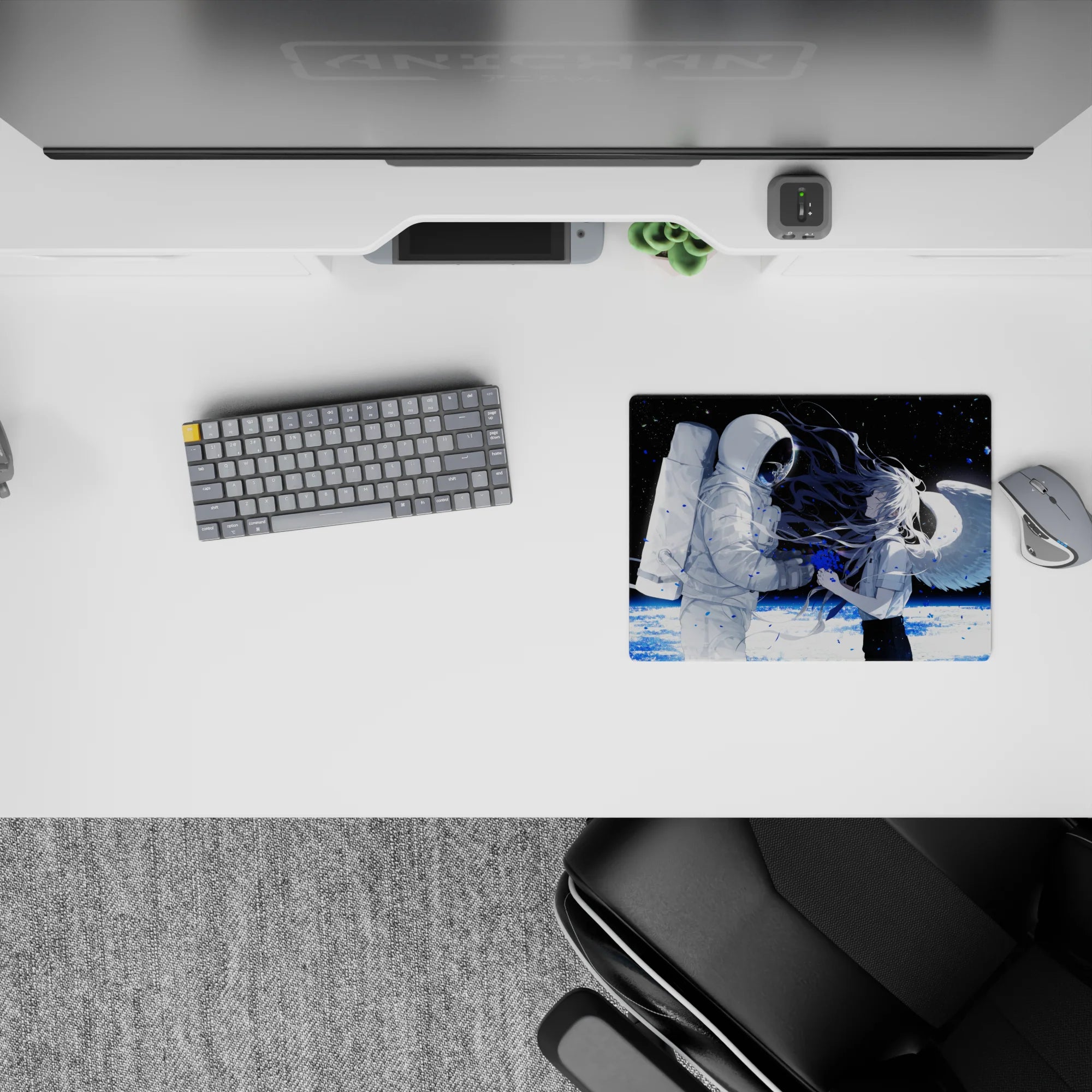 Moody black-and-white anime mouse pad 14x10 inches with icy planet glow and blue paint-splash accents.