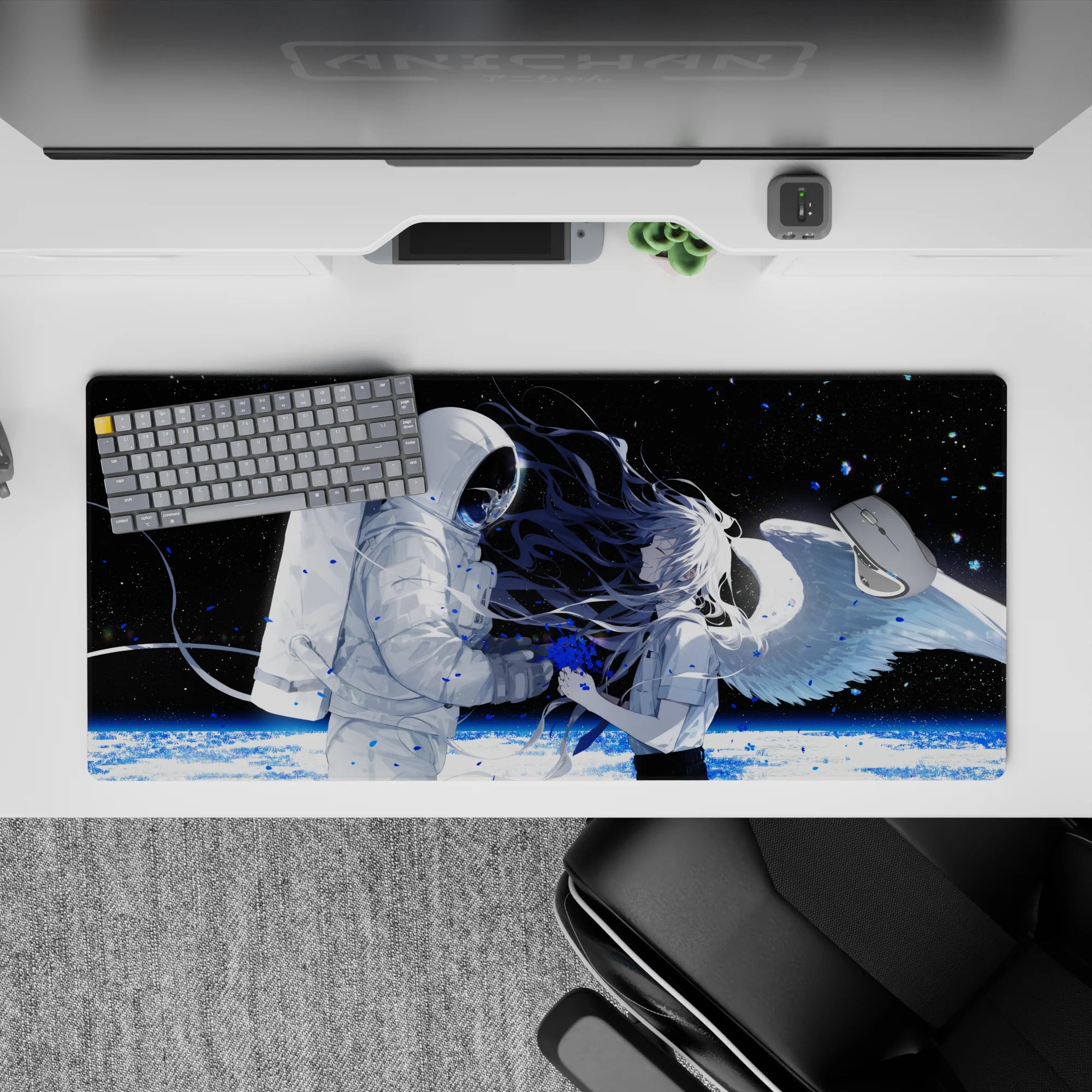 Moody black-and-white anime desk pad 36x16 inches with blue paint-splash accents and icy planet light.