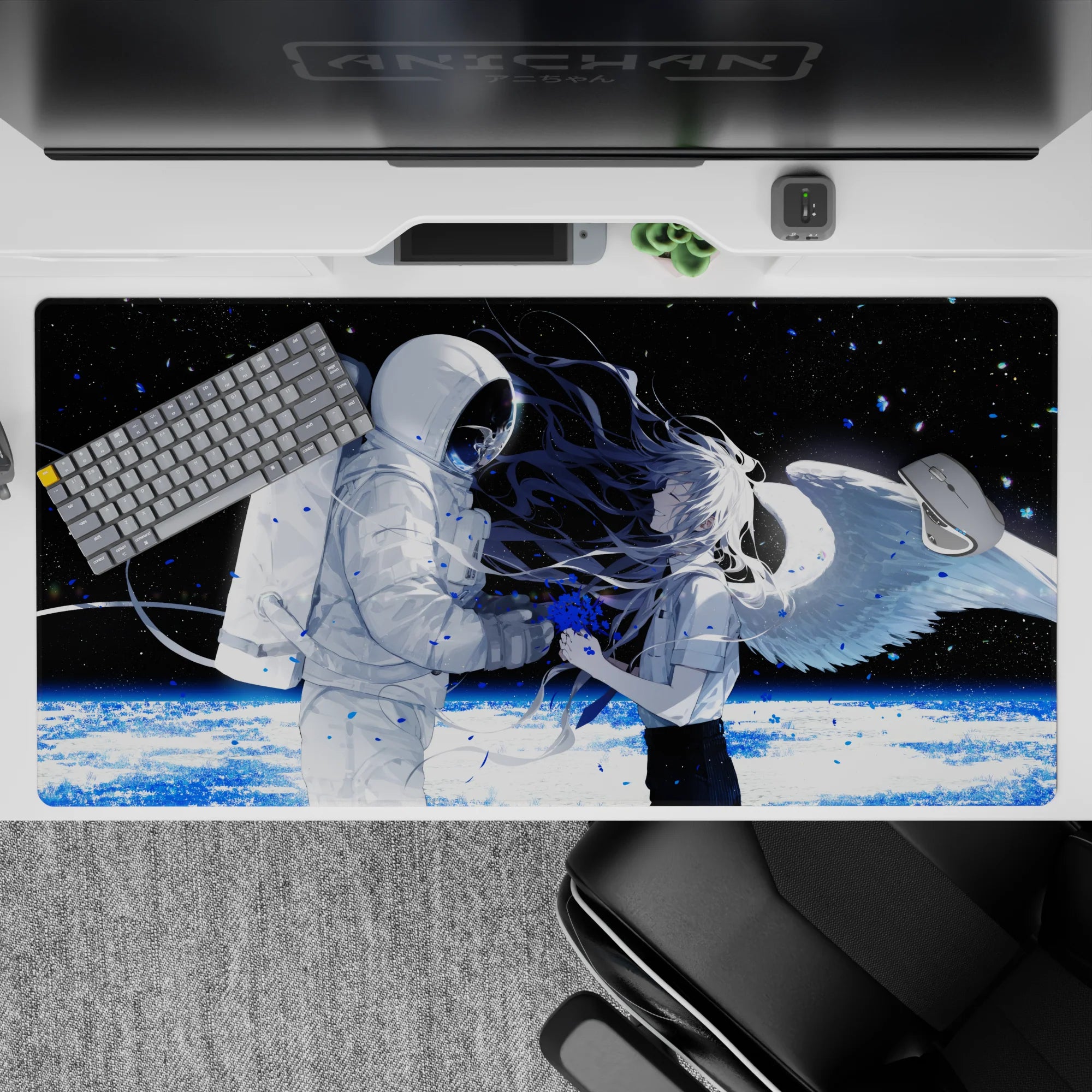 Moody black-and-white anime desk pad with blue paint-splash accents and icy planet glow, 40x20 inches.