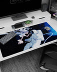 Anime girl 40x20 inches desk pad showing silver-haired girl with wings reaching toward an astronaut, tether swirling.