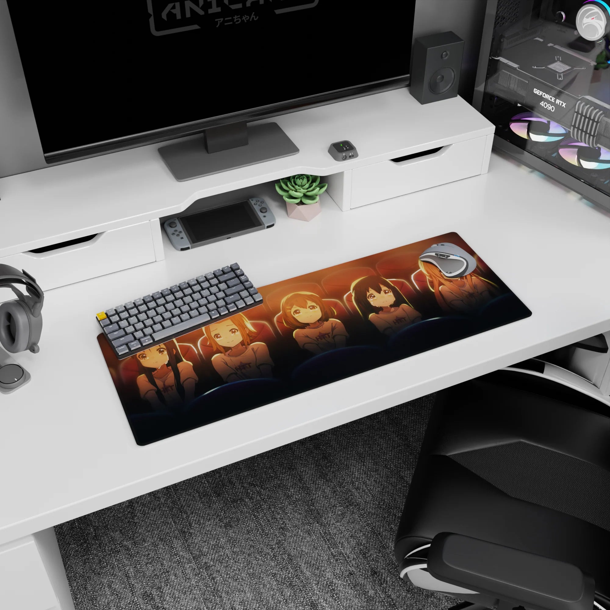 Five sparkly-eyed anime girls huddled in a movie theater pose on a 32x12 inches mouse pad.