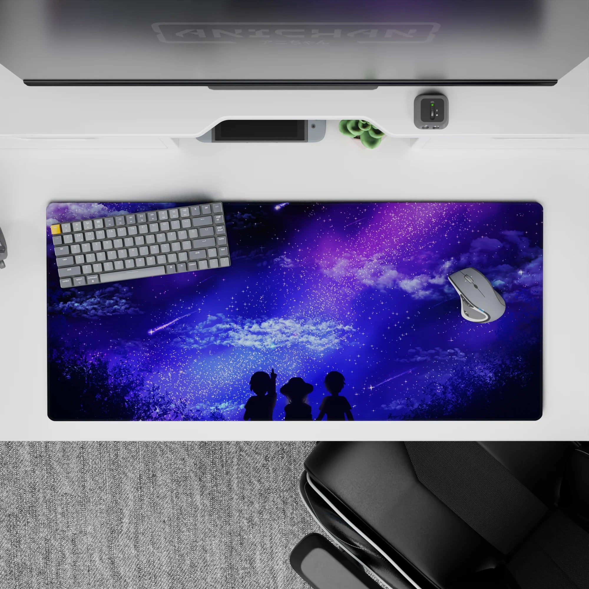 Anime desk pad featuring dreamy skies with shooting stars, silhouettes under a galaxy in purples and blues, 36x16 inches.