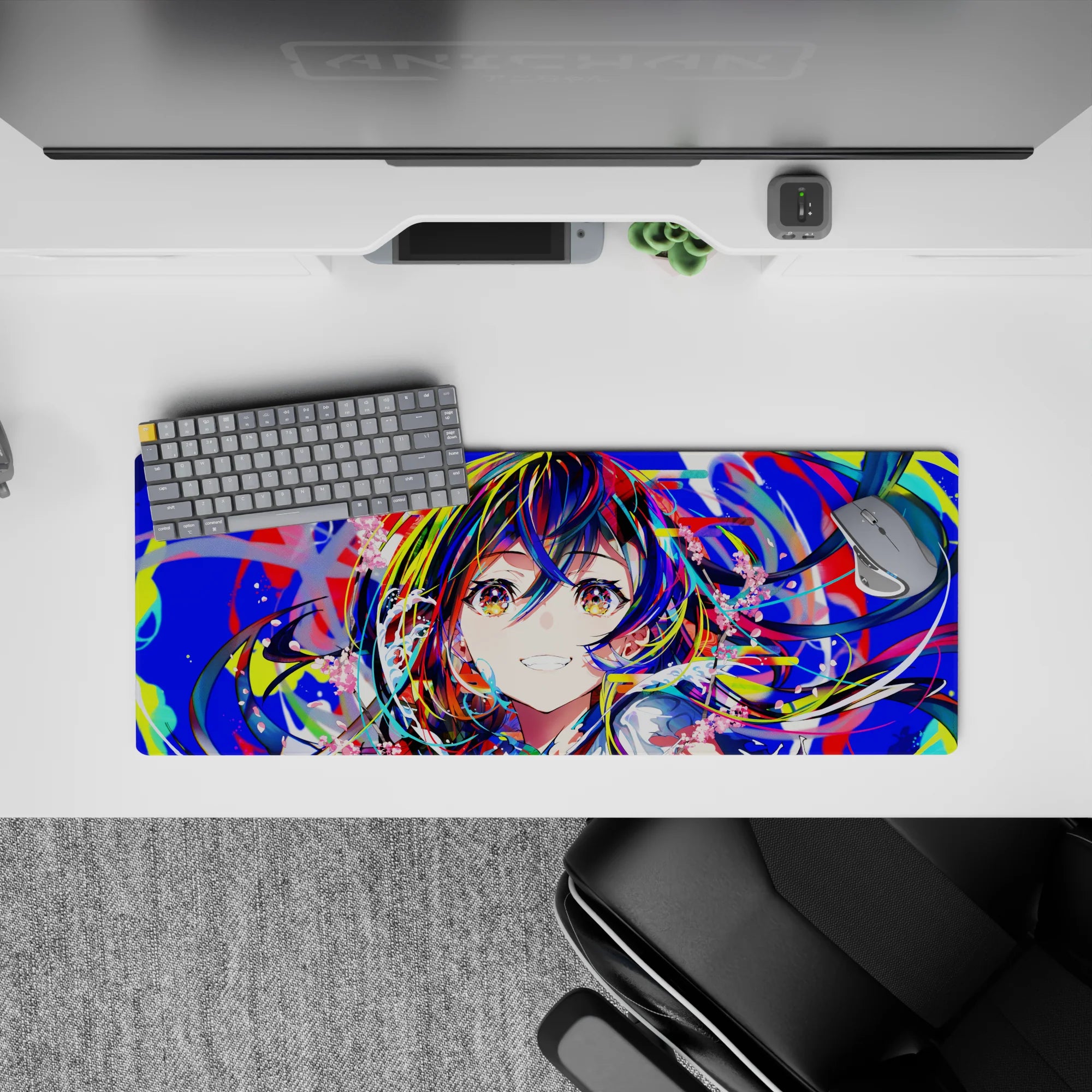 Vibrant 32x12 inches anime girl mouse pad in neon blues, hot reds, lime splashes, and candy-pink.
