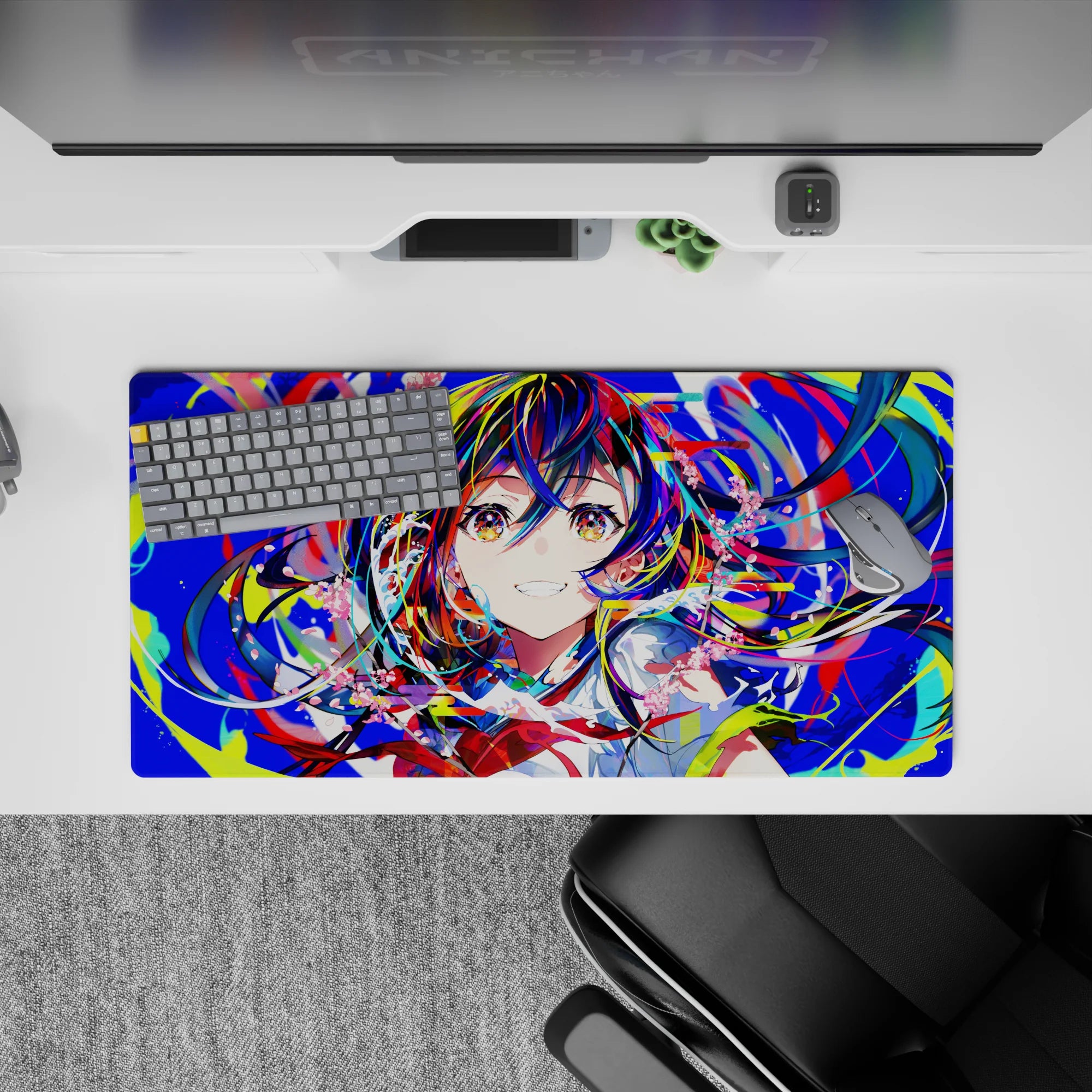 32x16 inches neon anime desk mat in blues, reds, lime, and candy-pink petals for bright gaming vibes.