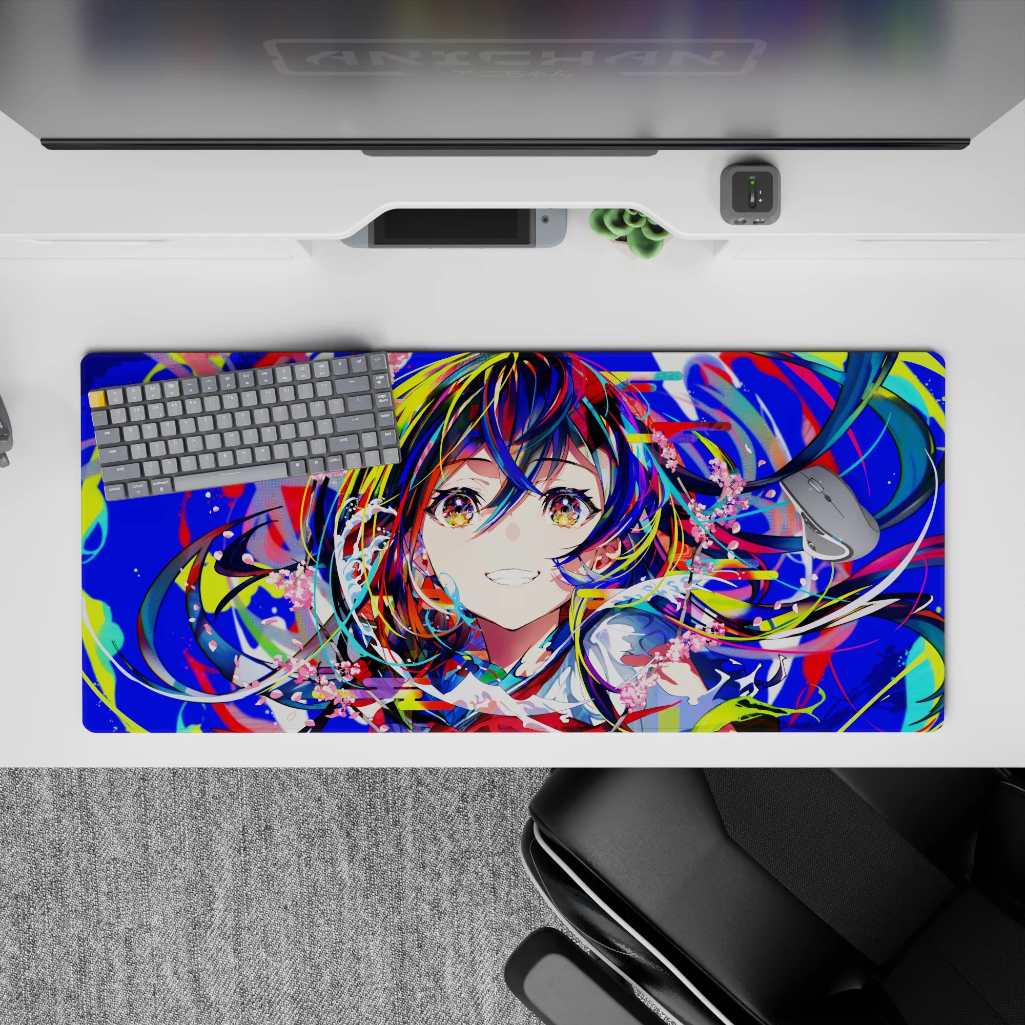 Vibrant 36x16 inches anime desk pad in neon blues, hot reds, lime splashes, and candy-pink petals.