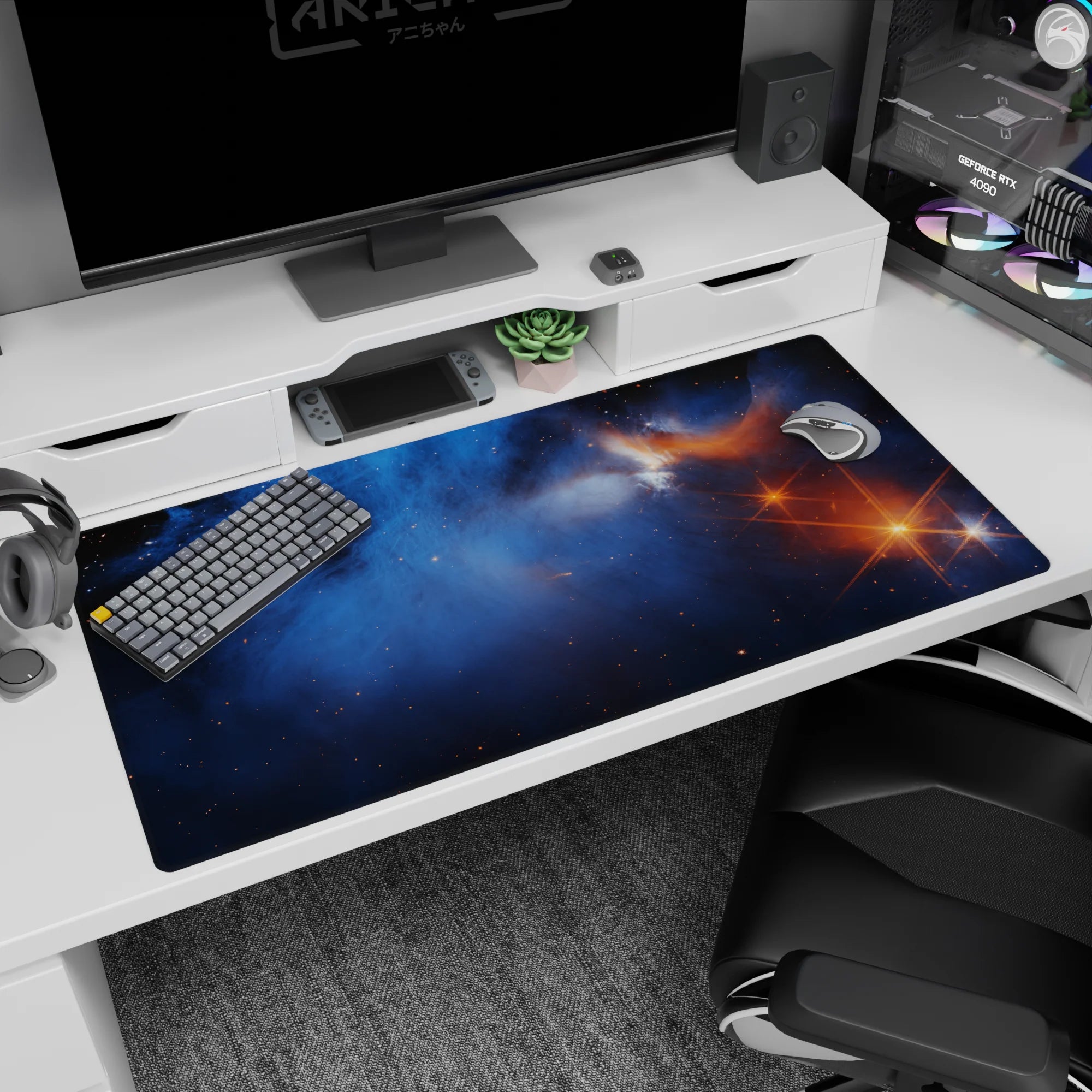 Galaxy-themed desk pad 40x20 inches with smoky blue nebula design, tiny stars, and warm orange flare.
