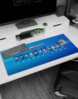 Mega Man desk pad showing evolving helmet looks and battle-ready poses, 36x16 inches.