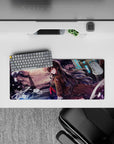 Anime girl mouse pad 28x12 inches in violet-orange storm hues with neon-blue glow and gritty-cute vibe.
