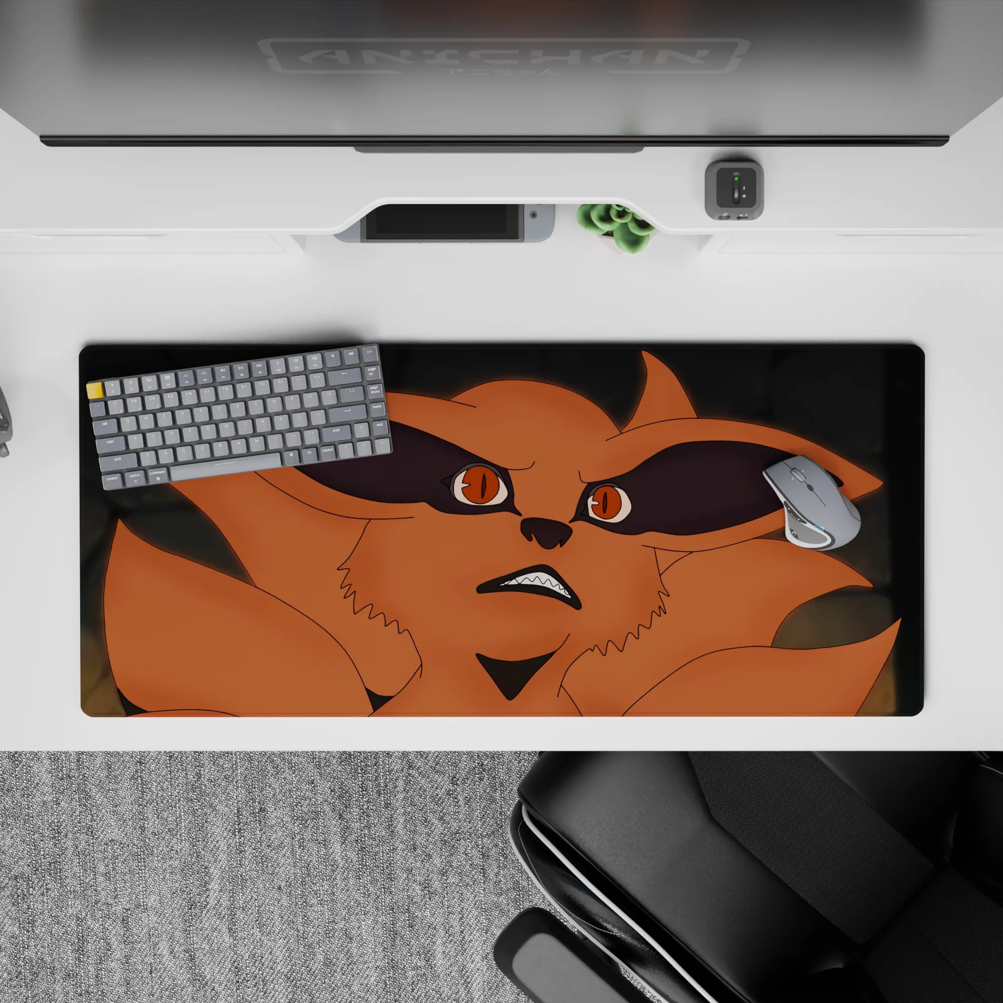 Orange fox fury on anime desk pad 36x16 inches, dramatic black shadows and sleek gray background mood.