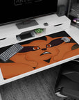40x20 inches Naruto desk pad showing Kurama staring up with an oh-no grin, orange fury on gray stone.
