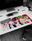 36x16 inches anime girl desk pad showing orange girl with green bow beside red girl with star hair clip.
