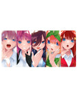 Anime girl mouse pad 32x16 inches with five glossy blue-eyed girls lined up in a candy-colored chorus.
