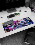 Pink-haired girl in yellow glasses with blue-haired partner in tiny top hat on anime mouse pad 32x12 inches.