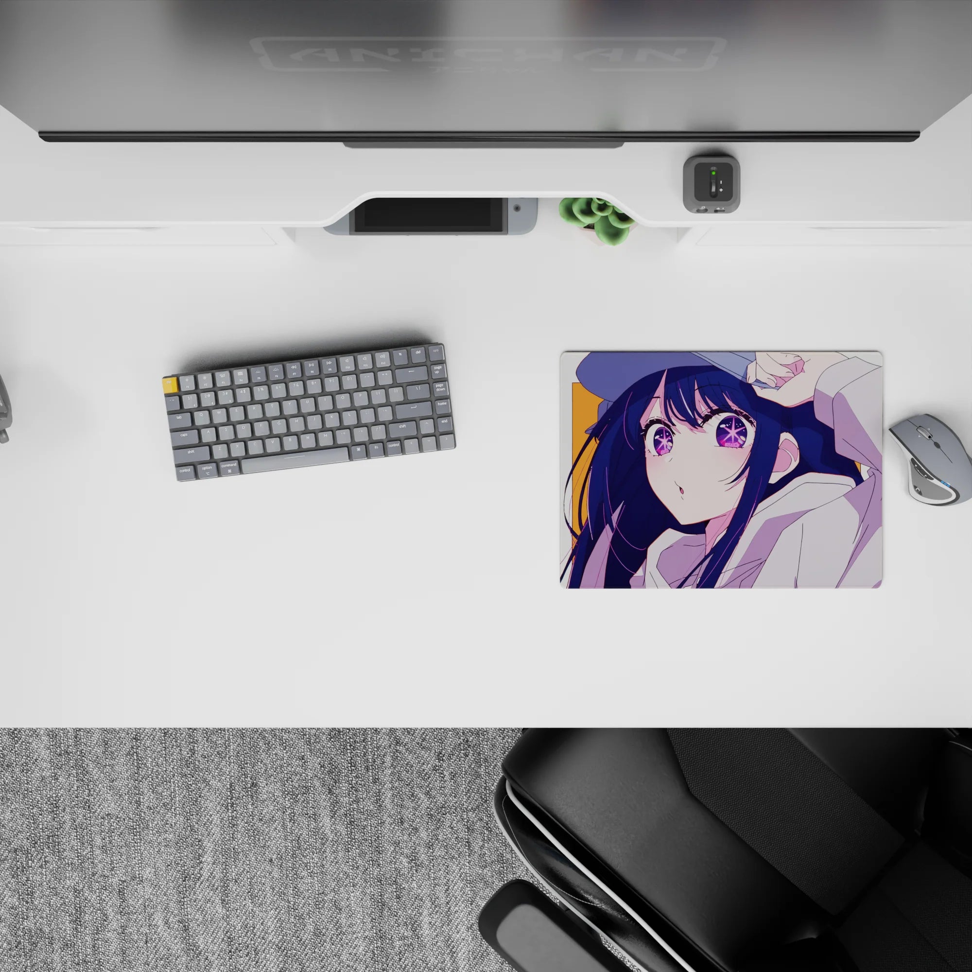 Cute cheeky anime mouse pad 14x10 inches, navy hair and purple eyes on a bright orange backdrop.
