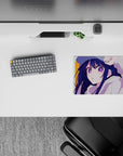 Cute cheeky anime mouse pad 14x10 inches, navy hair and purple eyes on a bright orange backdrop.