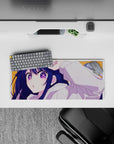 28x12 inches anime girl desk mat in warm orange with starry purple eyes and bright, playful vibe.
