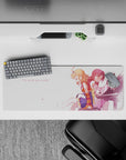 32x12 inches anime desk mat in soft pink light, peach and crimson hair, clean white space, bittersweet vibe.
