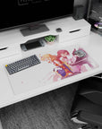 Anime girl mouse pad 32x16 inches showing peach-haired girl with braid beside red-haired pianist in pale dress.