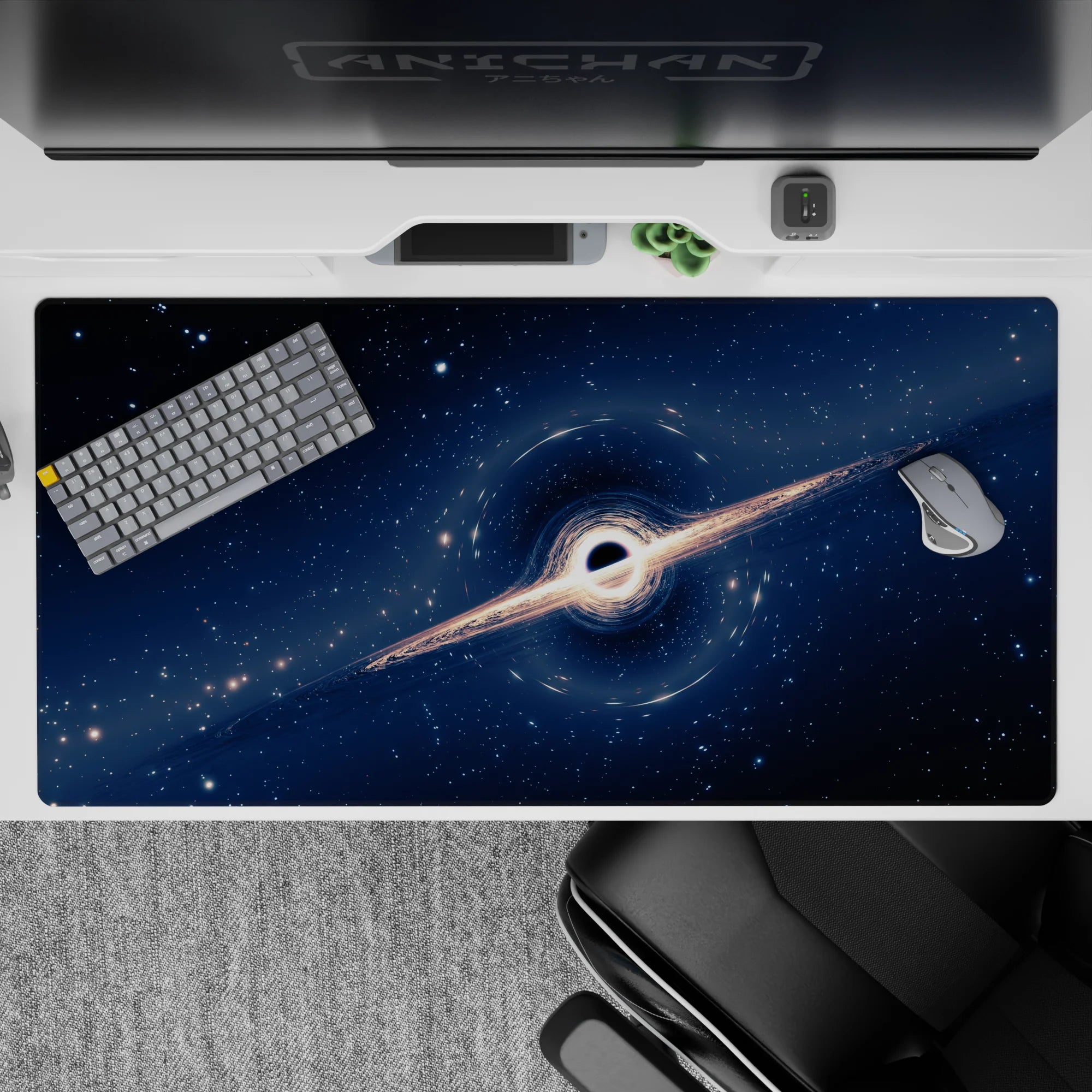 Cosmic desk pad 40x20 inches featuring swirling black hole design and starry navy backdrop for smooth workspace use.