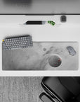 Large 32x12 inch desk mouse pad with misty gray cosmic clouds, soft planets, and subtle red accent specks.