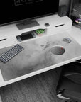 Smoky gray cosmic desk pad 40x20 inches with soft planets, subtle stars, and smooth surface for work or gaming.