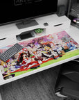 40x20 inches desk pad showing a red-white shrine maiden lounging as friends snack and pose in frilly aprons.