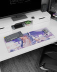 32x12 inches anime girl mouse pad with blue-to-lilac hair, blush cheeks, hand-to-lips pose on pillows.