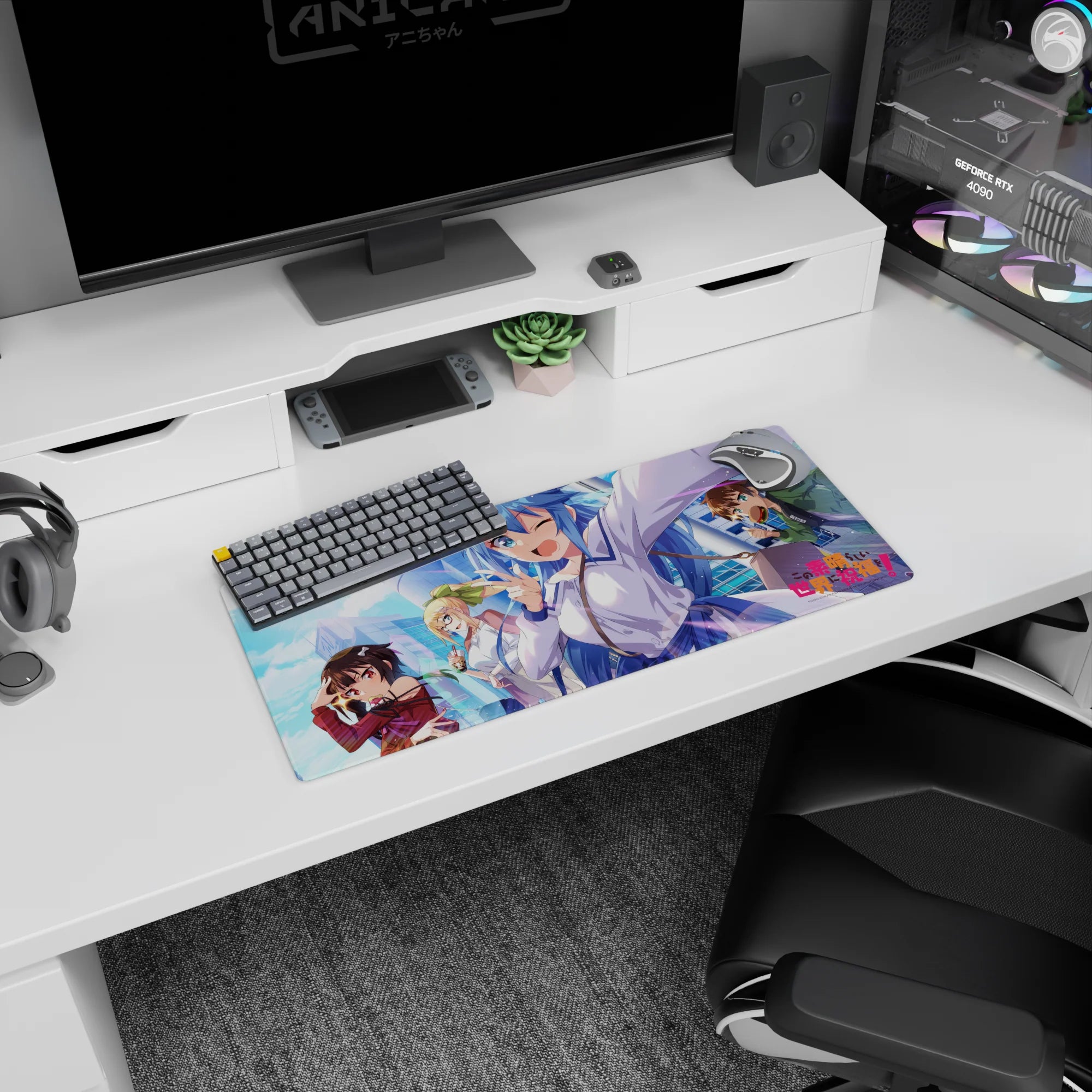 KonoSuba anime mouse pad 28x12 inches featuring Aqua, Megumin, Darkness, and Kazuma with vibrant cityscape background.