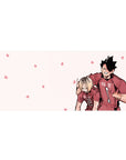 36x16 inches anime desk pad with two volleyball teammates, red jersey ace and blond partner on pink floral back.