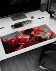 Anime warrior girl in black with tassel earrings amid a swirling crimson storm desk pad 36x16 inches.