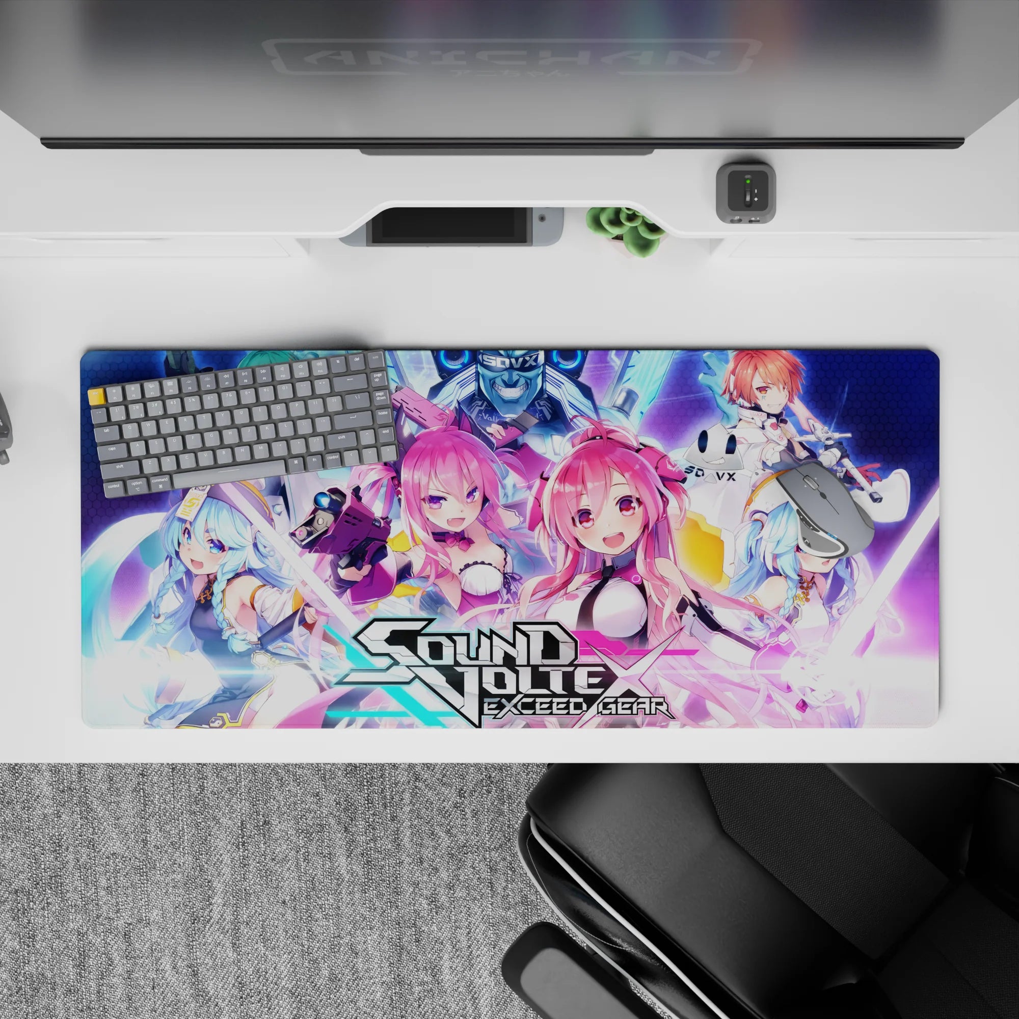 Neon pink, teal, violet and electric blue anime desk pad 36x16 inches on hex-grid, loud cute vibe.