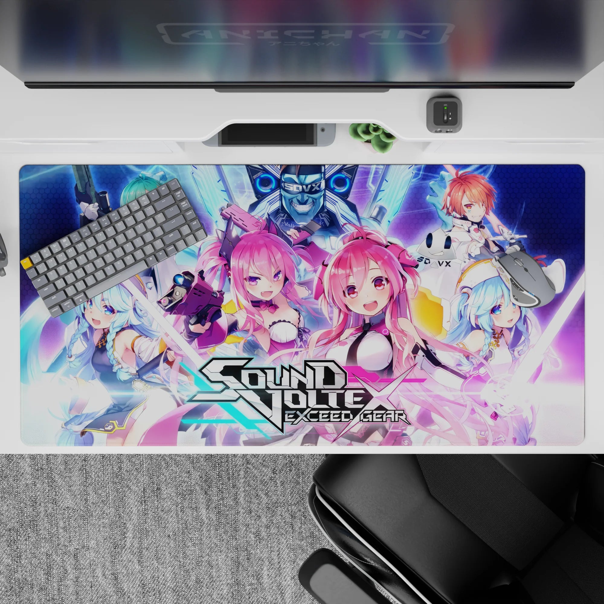 Neon pink, electric blue, and violet chaotic gamer vibe anime girl desk pad, 40x20 inches.