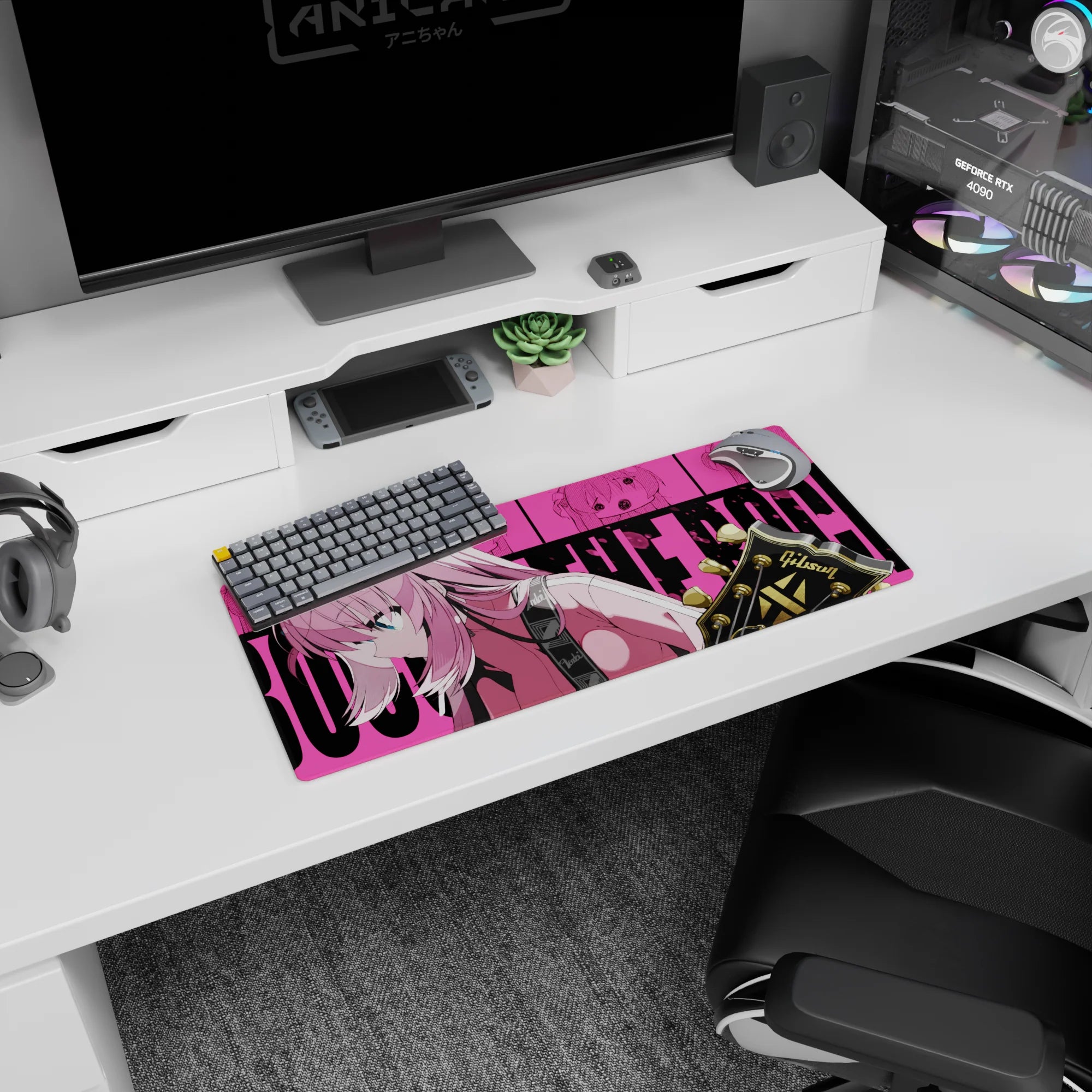 28x12 inches anime girl mouse pad showing a focused pink-haired girl leaning forward with a guitar in frame.