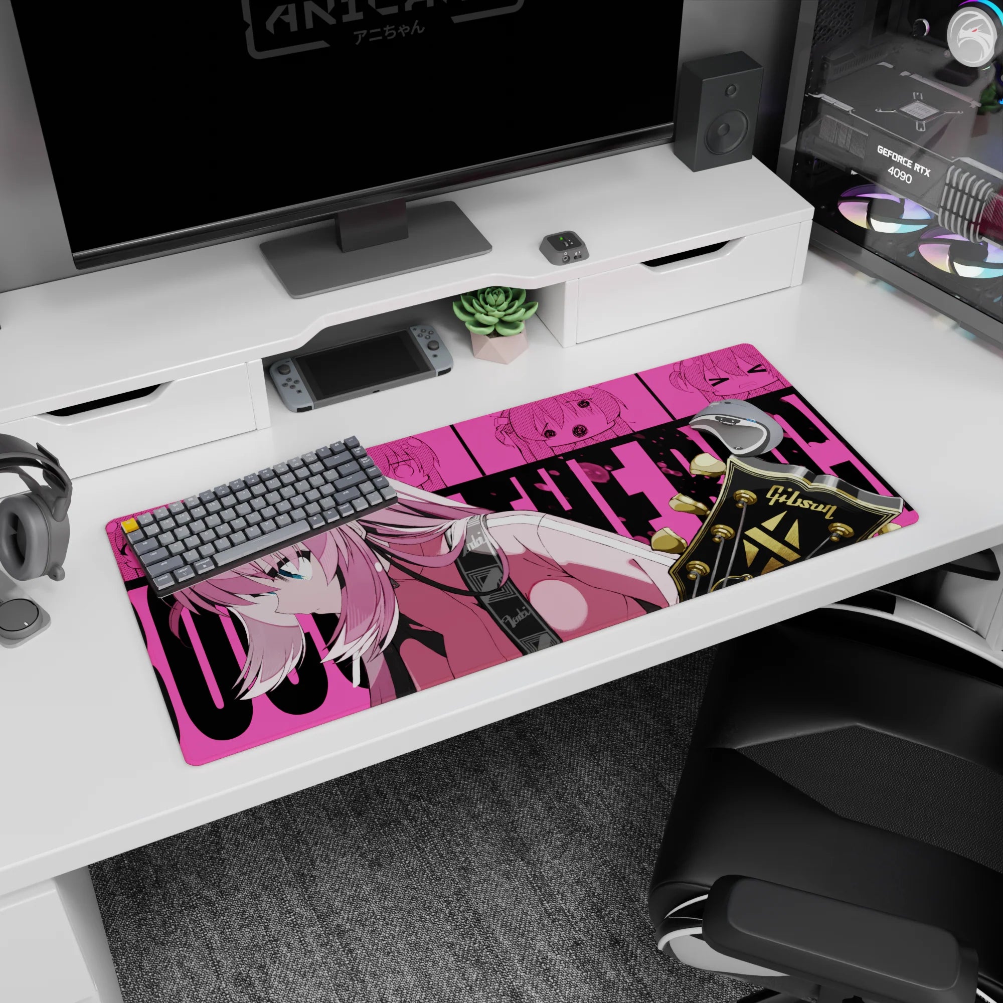 36x16 inches anime girl desk pad featuring focused pink-haired guitarist leaning in beside black-and-gold headstock.