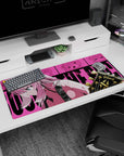36x16 inches anime girl desk pad featuring focused pink-haired guitarist leaning in beside black-and-gold headstock.