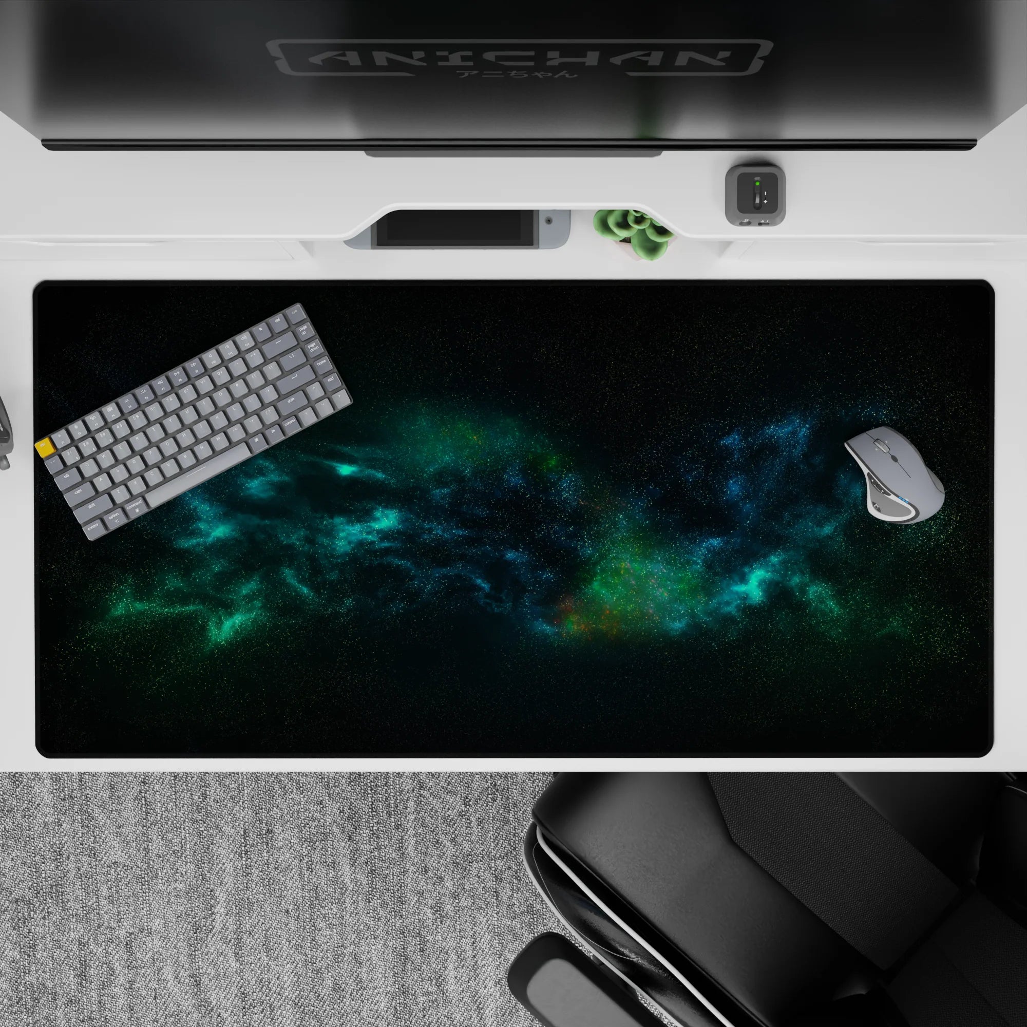 Cosmic-themed desk pad 40x20 inches with teal and ocean-blue nebula pattern against a velvet-black sky.