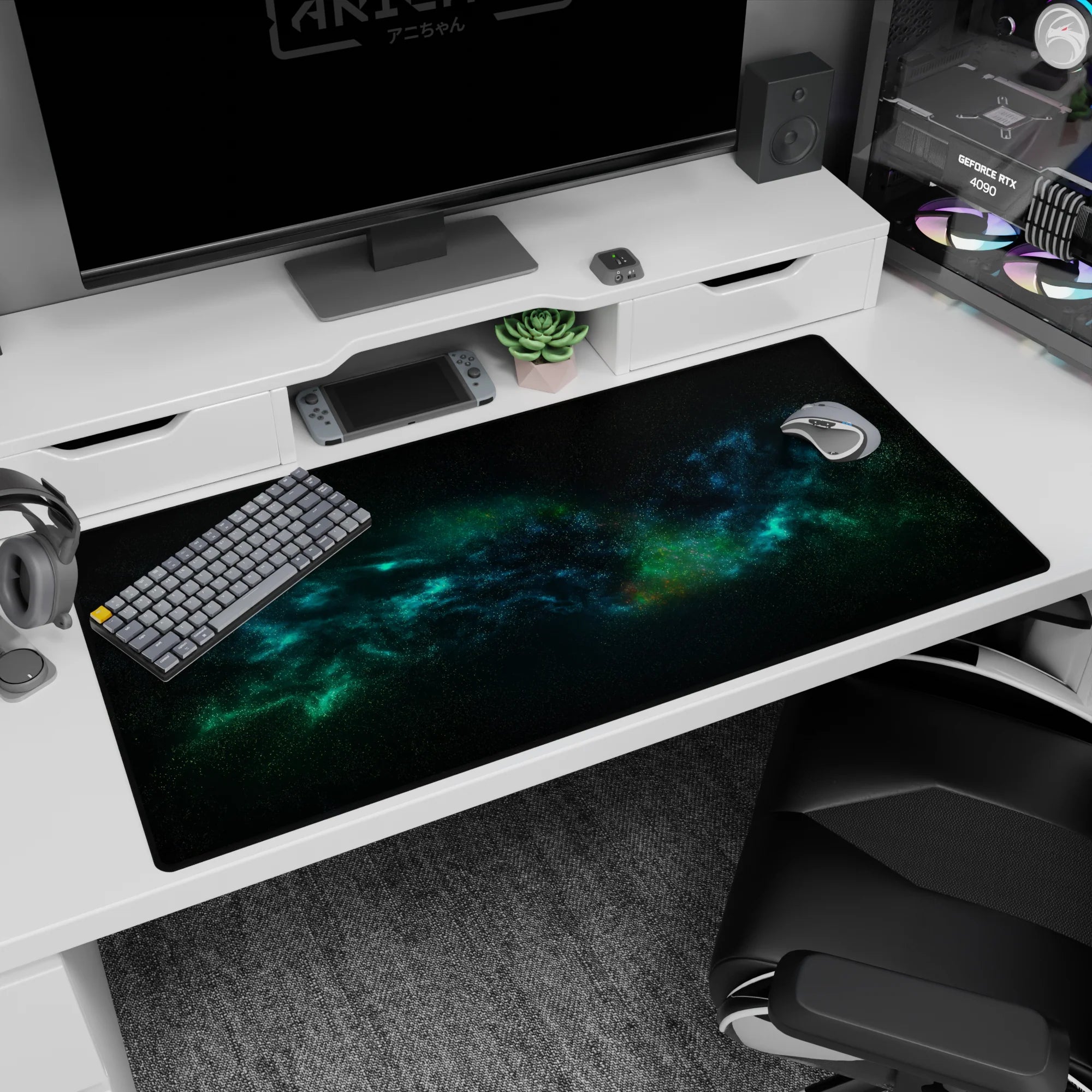 Cosmic desk pad 40x20 inches with teal and blue nebula design, smooth surface for precise mouse control.
