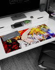 Meliodas Seven Deadly Sins desk pad 36x16 inches with cheeky grin, tilted pose, and crackling red scene.