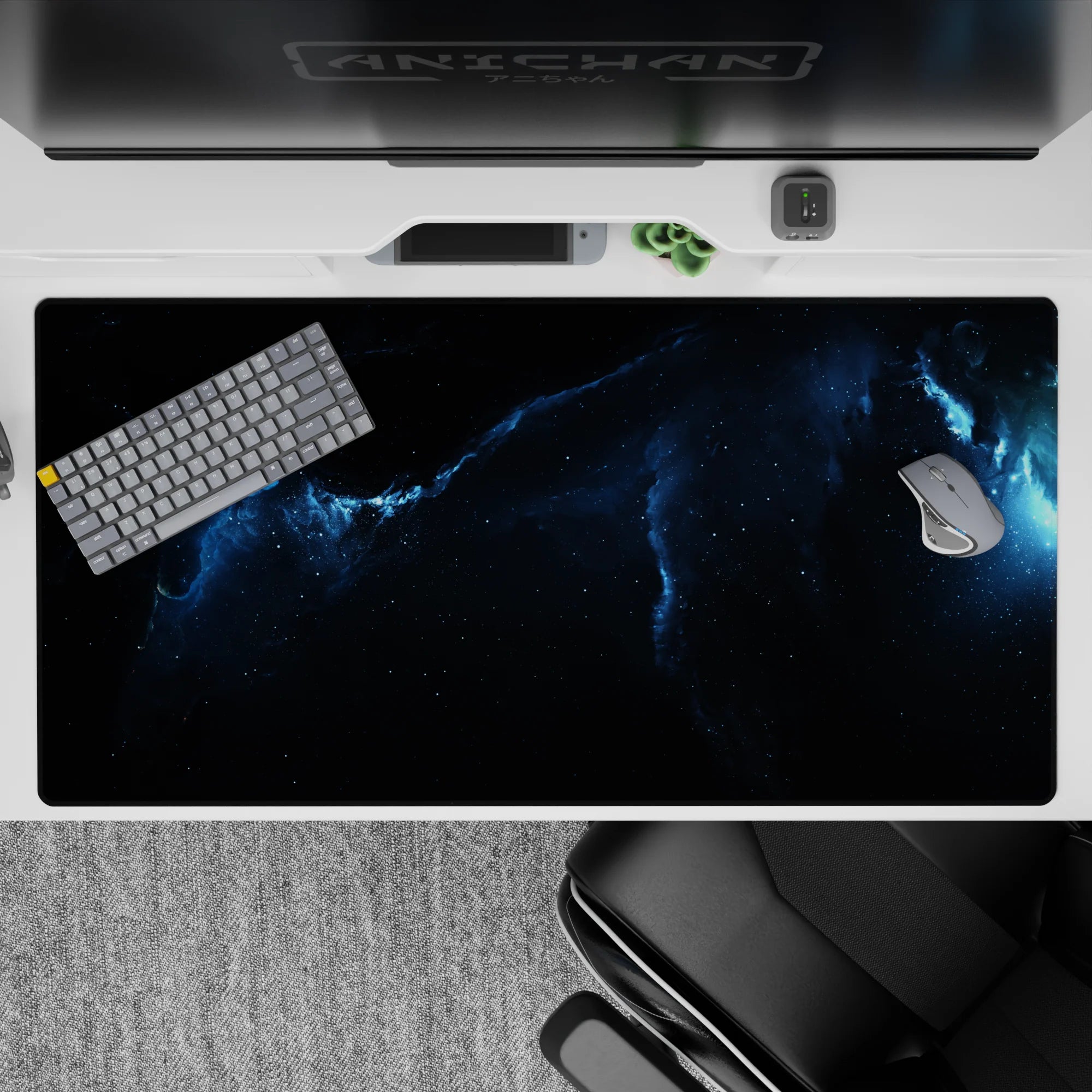 Calming deep space desk pad 40x20 inches in inky black and stormy blue tones with a powerful glow.