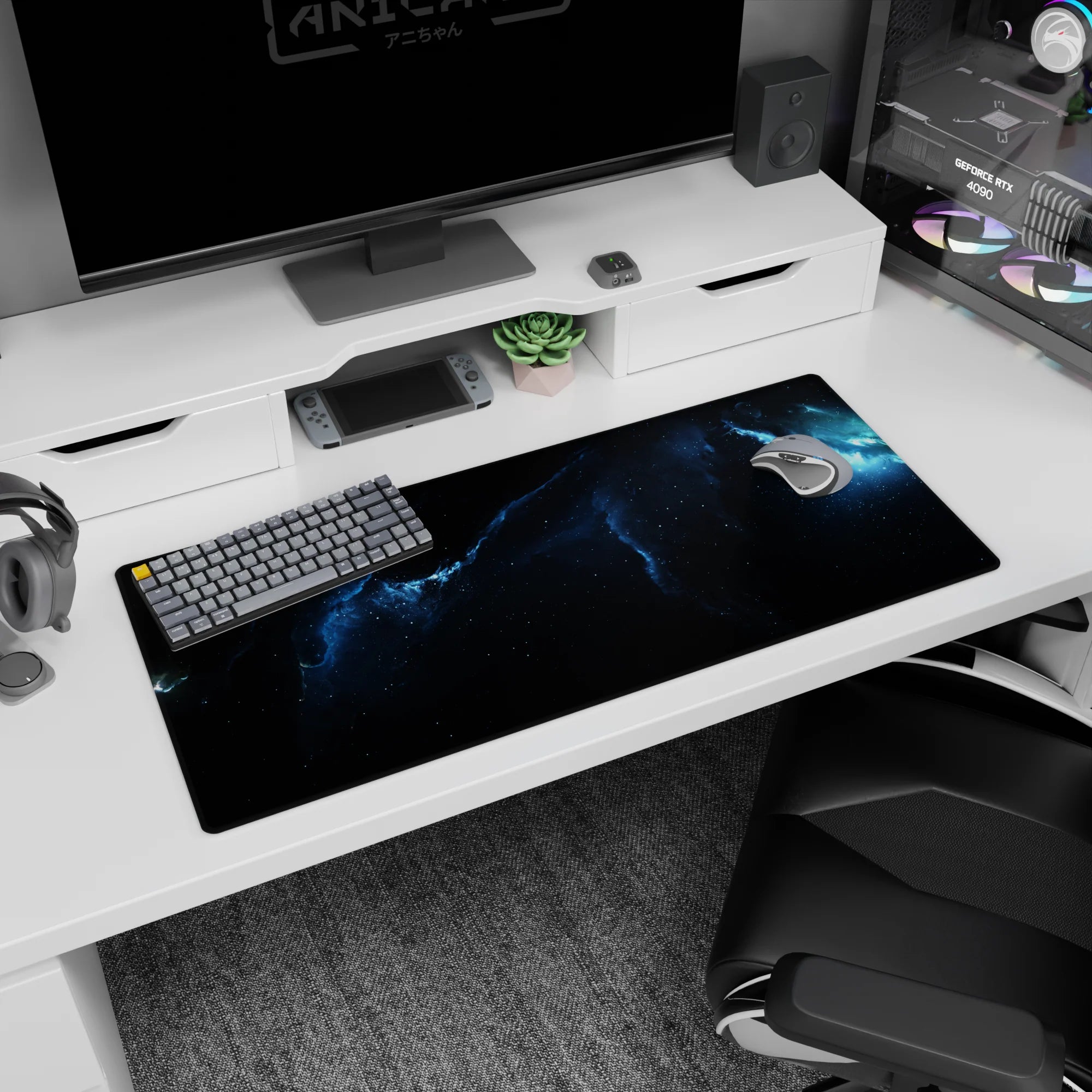 Glowing nebula ribbon scene desk pad 36x16 inches with tiny stars across a dark sky.