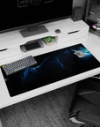 Glowing nebula ribbon scene desk pad 36x16 inches with tiny stars across a dark sky.