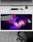 Calming space vibe mouse pad 32x16 inches in deep violet, electric lilac, and warm orange nebula glow.