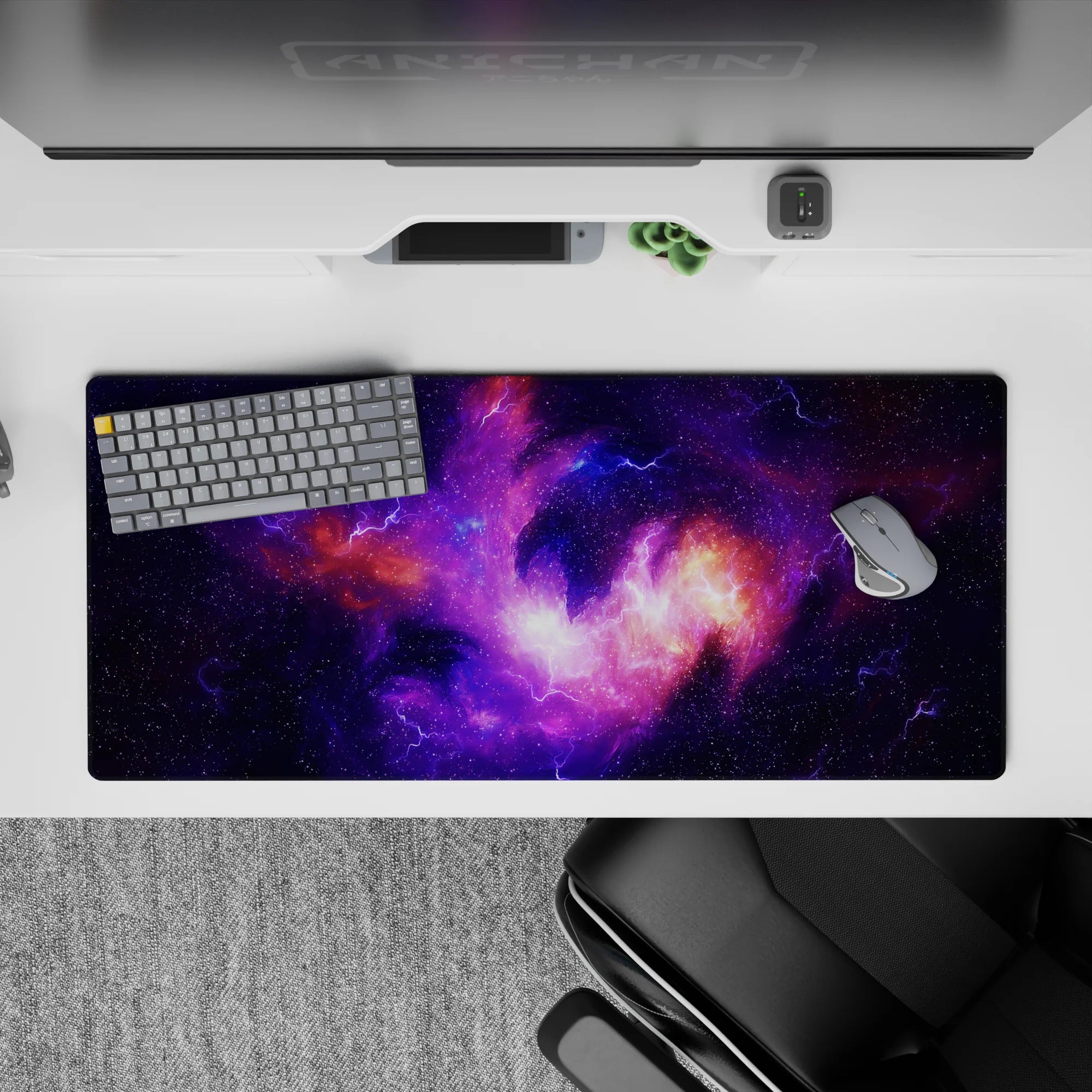 Deep violet and lilac desk pad 36x16 inches with warm orange nebula glow, calm late-night vibe.